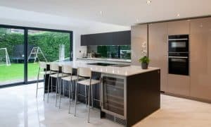 The Benefits of a Kitchen Island and how to make it work for your space Modern Kitchen With Island and Glossy Finish